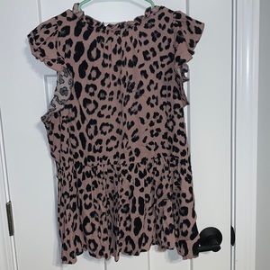 Ruffle collar/shoulder peplum top. Blush color